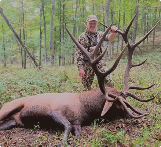 Hunter with an elk