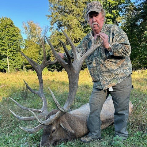 Hunter with elk